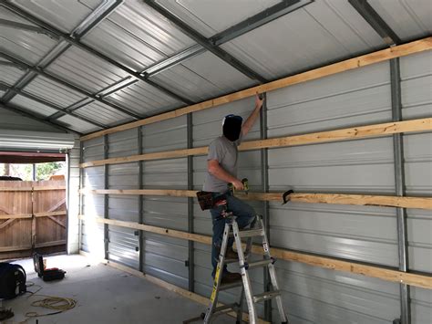 wood or metal framing a house|finishing inside of metal garage.